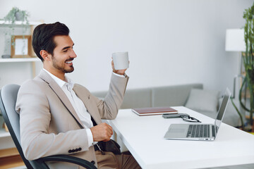 Man businessman executive business computer coffee laptop office video call guy smiling