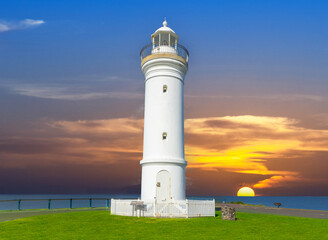 Beautiful lighthouse at Sunset over the Pacific Ocean on cliffs of Kiama Sydney NSW Australia...