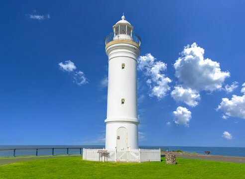 Beautiful lighthouse looking over the Pacific Ocean on cliffs of Kiama Sydney NSW Australia Coastal Beach fishing Town
