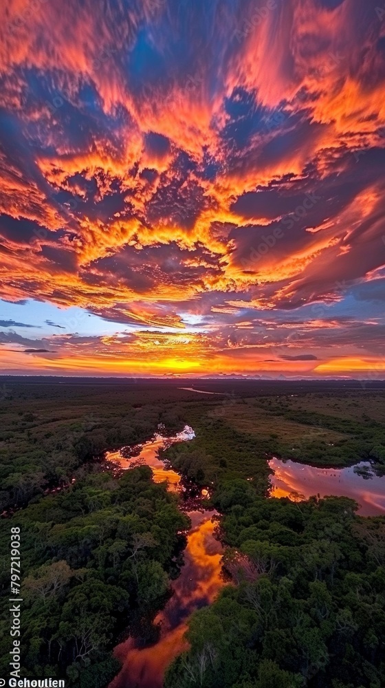 Canvas Prints Fiery sky over serene wetlands at sunset