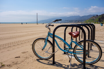 Beach cruiser bicycle parked on the beach off the marvin braude bike path in santa monica...
