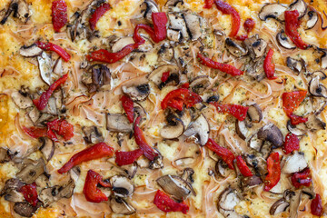 Close up of a pizza with red pepper
