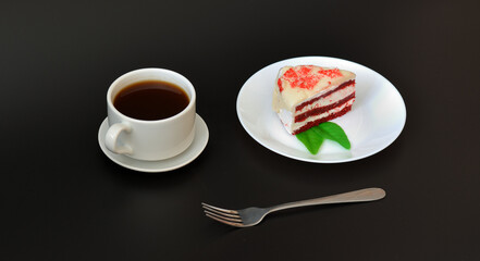 A cup of hot black coffee on a saucer and a plate with a piece of red velvet cake and mint leaves on a black background.