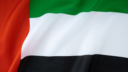 National symbol of UAE. United Arab Emirates flag background. Copy space for your text. Concept of...