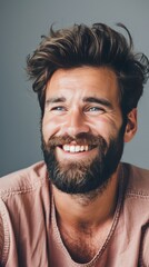 Fototapeta premium Man with a beard and healthy hair smiling in a casual setting