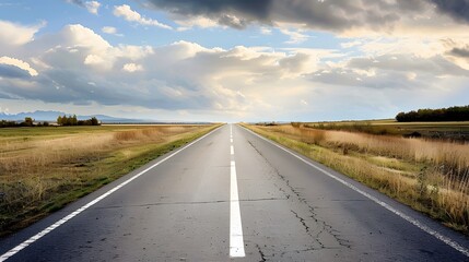 An empty road leading into the distance, with clouds in the sky and fields on both sides. Creating a sense of calmness and focus.