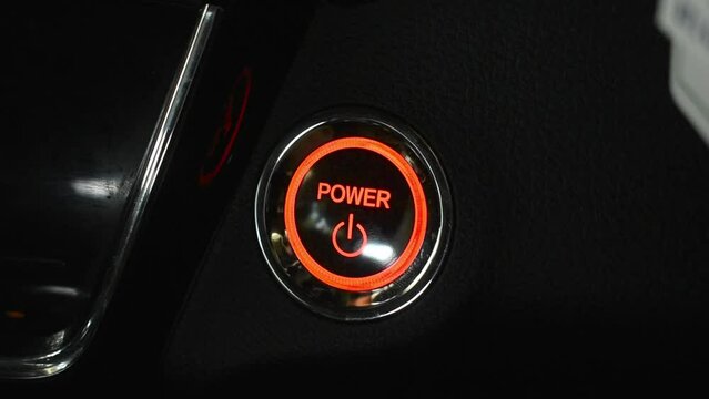 pressing Push button car start on hybrid electric car, push start stop button, car ignition button