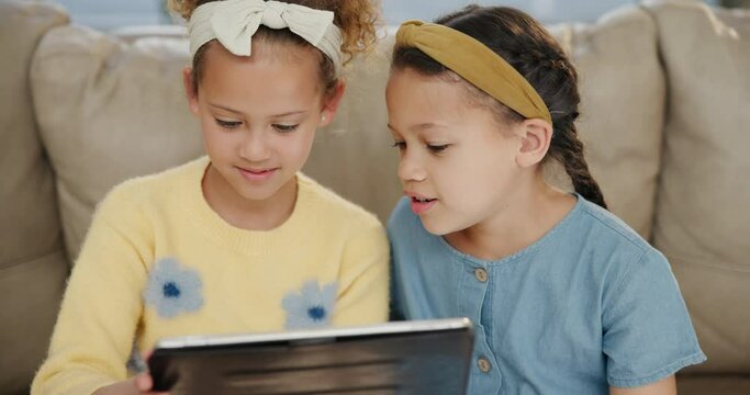 Tablet, children and siblings on sofa for cartoon, search or remote e learning app, sign up or streaming at home. Digital, family and girl kids in living room for online, gaming or Netflix and chill