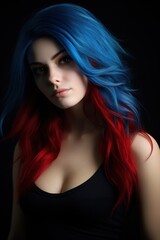 Fototapeta premium Young woman with vibrant blue and red hair