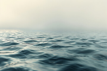 Calm Blue Waters with Gentle Ripples under a Misty Sky - obrazy, fototapety, plakaty