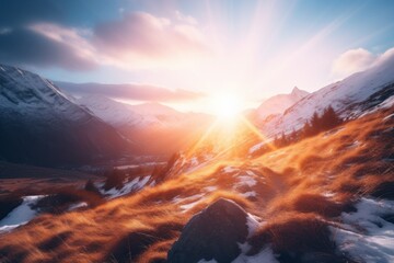 a sun shining through the clouds over a snowy mountain