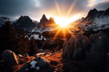 a sun shining through the mountains