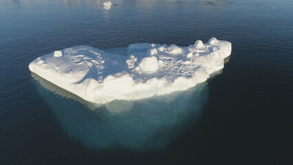 Close-up Iceberg Floating In Antarctic Ocean. Aerial Flight Over Snow-White Ice in Antarctica South...