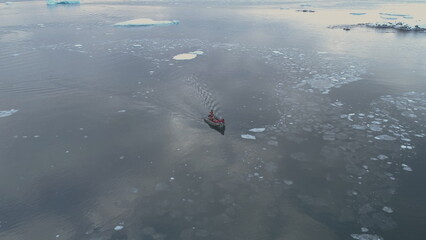 Zodiac Boat Sail Brash Ice Tracking Aerial View. Flight Above Transport Rubber Boat Float in...