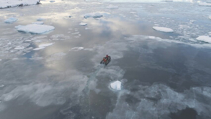 Zodiac Boat Sail Brash Ice Water Back Aerial View. Expedition Rubber Transport Explore Extreme...