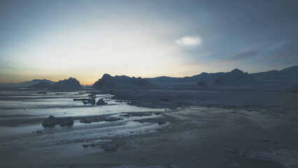 Polar Night Above Arctic Snow Mountain Aerial View. Sunrise in Antarctic Winter Ocean Open Water...