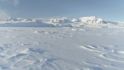 Snow Covered Antarctic Surface Aerial View Flight. South Pole Ice Landscape. Winter Frozen Ground...