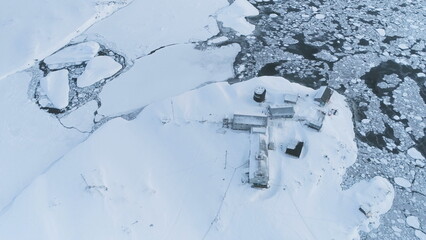 Vernadsky Station Among Antarctica Polar Landscape. Aerial Flight Over Antarctic Continent. Snow...