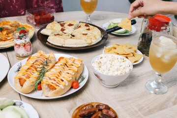 Family Eating Snack and Meal Together During Watch Superbowl Match at Home