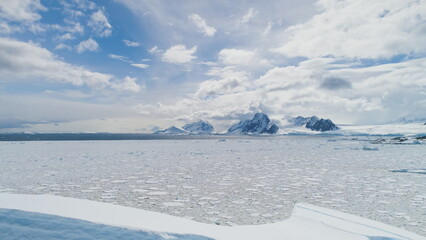 Antarctic Iceberg Harsh Snow Land Wild Nature Aerial View. Frozen Ice South Polar Landscape Surface...