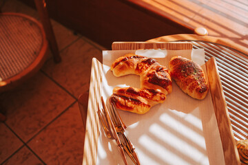 Buns in sunlight side view. Croissant for breakfast. Delicious baking concept