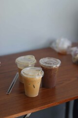 Closeup of Iced Caramel Macchiato at the coffee shop, Caramel Macchiato is a classic macchiato beverage. It consists of vanilla syrup, espresso, steamed milk, foam, and caramel drizzle