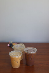 Closeup of Iced Caramel Macchiato at the coffee shop, Caramel Macchiato is a classic macchiato beverage. It consists of vanilla syrup, espresso, steamed milk, foam, and caramel drizzle