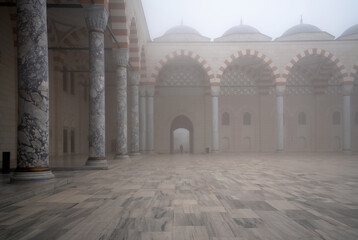 View of the courtyard of the Chamlija Mosque, the largest mosque in Turkey, on a foggy day,...