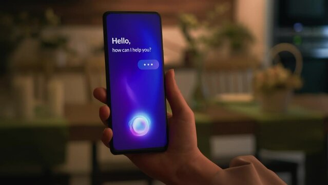 Using smart virtual assistant on smartphone. AI voice assistant app for mobile phone.