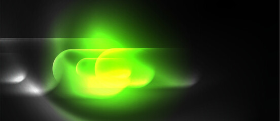 A vibrant green and yellow light illuminates a black background, creating a stunning visual effect. The colors resemble an electric blue gas in the darkness, forming a mesmerizing circle of light