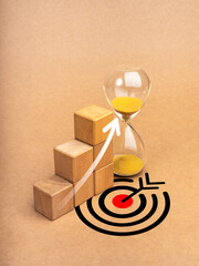 Return on Investment financial (ROI), business success and marketing goal concepts. Rise arrow on wooden cube blocks as growth graph steps near hourglass on eco brown background with big target icon.