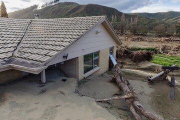 Silt and house buried and damaged in the Cyclone Gabrielle natural disaster. Eskdale, Napier,...