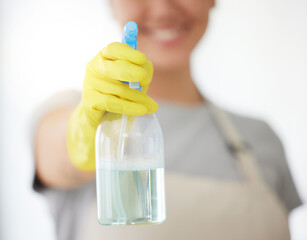 Person, hands and spray bottle with gloves for housekeeping, cleaning or domestic service at home. Closeup of maid or cleaner with chemical liquid for surface disinfection, hygiene or dirt removal - obrazy, fototapety, plakaty