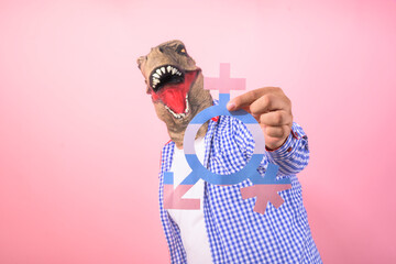 man with dinosaur mask with a transgender symbol in the foreground. concept of equality