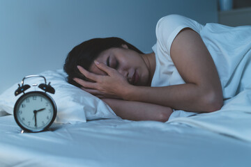 Close-up Young Asian woman have insomnia on the bed