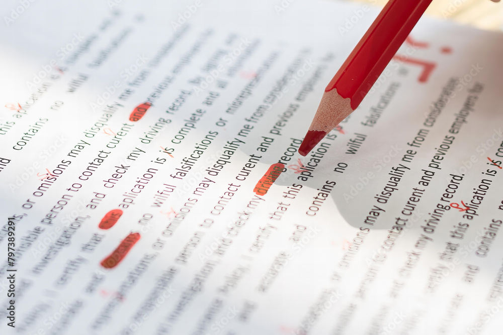 Poster person marking error with red marker