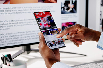 Watching Online News Article On Mobile Phone And Laptop