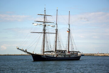 Masts in the port against the blue sky.