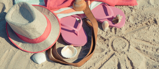Shape of sun and different accessories for relax on sand. Straw hat, slippers and towel. Summer...