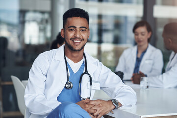 Portrait, male doctor and hospital for healthcare, physician and medical health staff. Professional, expert and surgeon with stethoscope, man person or cardiologist for case research with colleagues