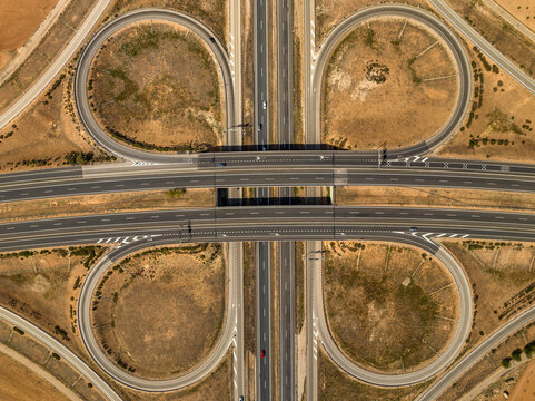 Aerial view of the intersection between the A-4 and A-43 highways near Manzanares, in the La Mancha region (Ciudad Real, Castilla La Mancha, Spain)