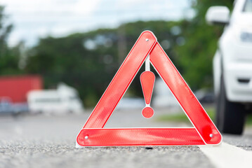 focus on the red triangle emergency stop sign