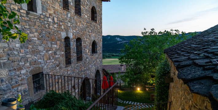 The scenic architecture of spanish village in mountain in Pyrenees mountains, Huesca, Aragon, Spain. Village of Anso, one of the most beautiful villages in Spain at the sunset.