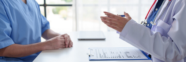 The doctor or pharmacist is discussing the results of the treatment by giving pills. With the patients who were examined, counseling ideas and treatment guidelines