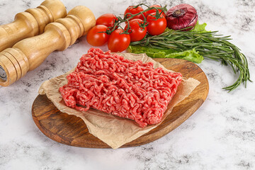 Raw minced beef meat on cutting board