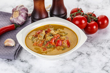 Traditional yellow Thai curry with chicken