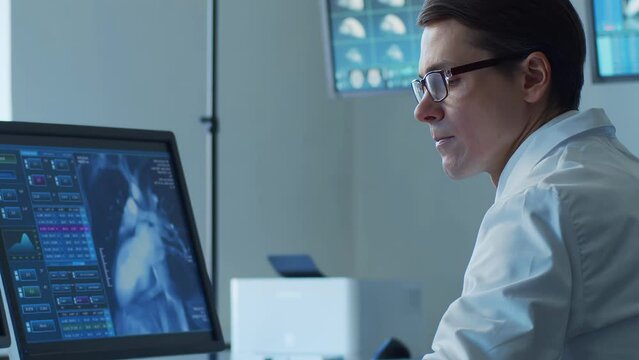 Professional medical doctors working in hospital office making computer research. Medicine, healthcare and technology concept.