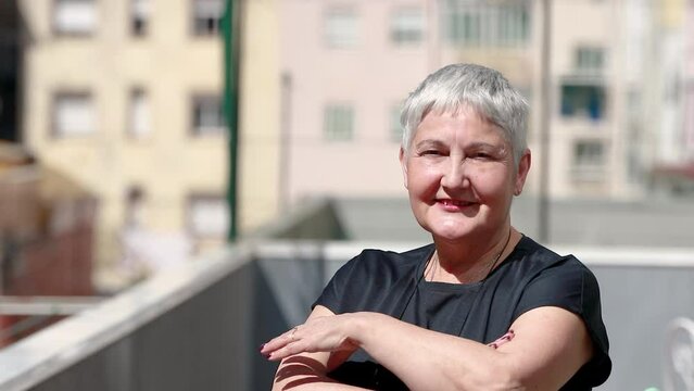 portrait senior woman 60s outdoors