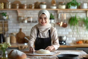 Muslim woman in hijab enjoys baking in kitchen. - Powered by Adobe