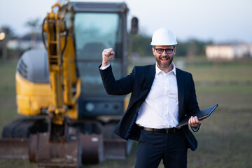 Worker in suit and helmet. Investor civil engineer, construction manager. Construction building...